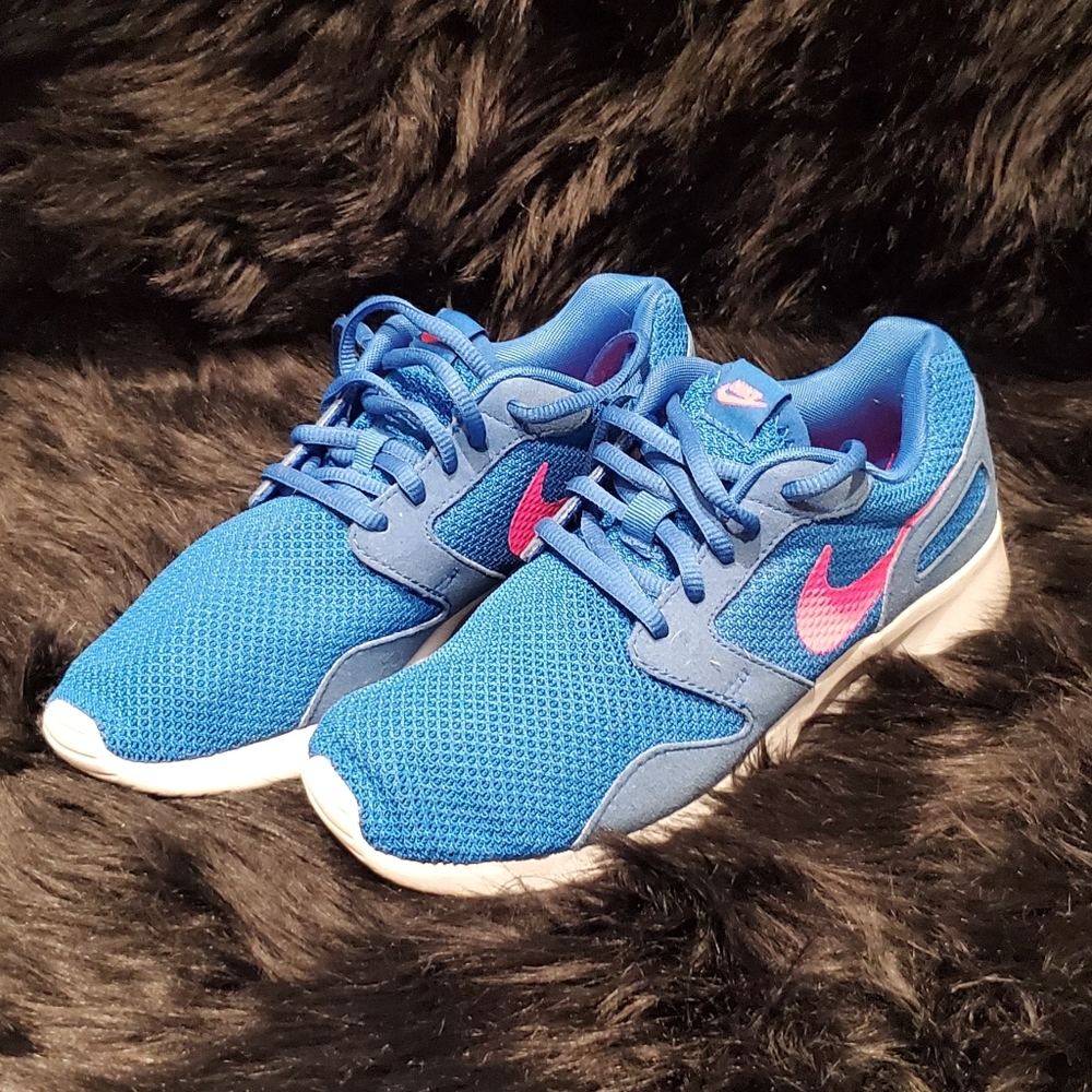 Blue and pink Nike running shoes